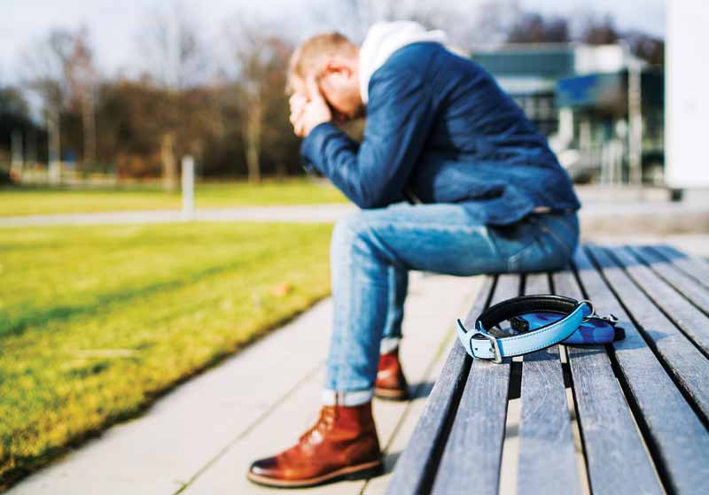 Man with head in his arms,