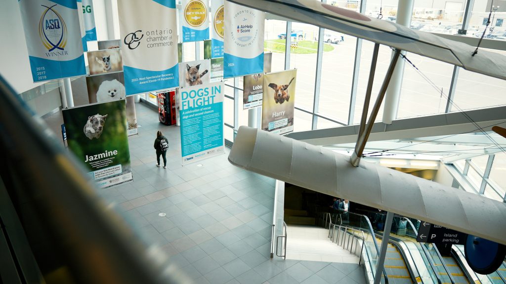 airport floor with banners hanging from ceiling