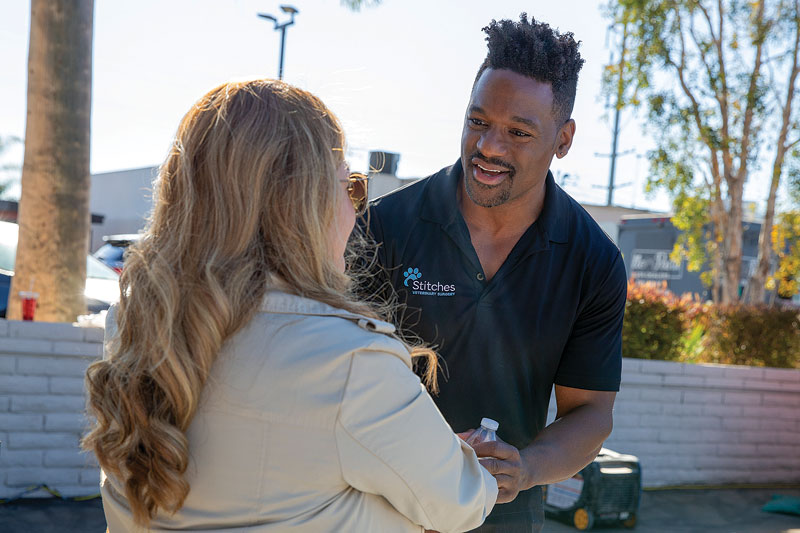 man speaking and smiling at woman